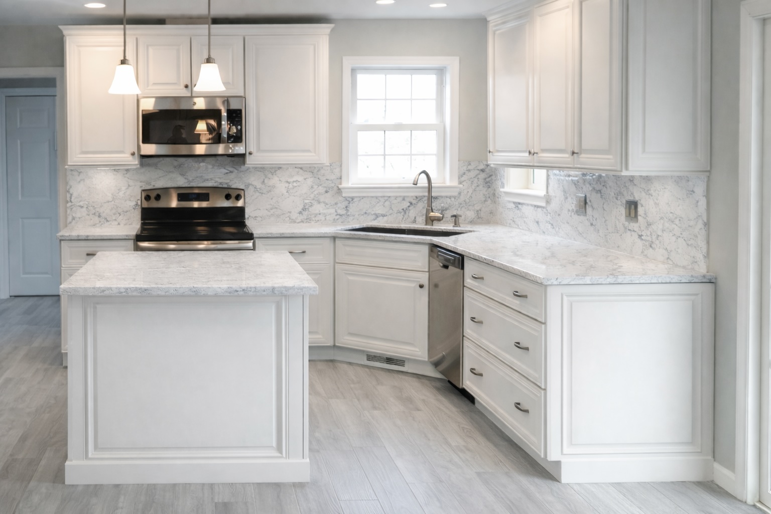 Modern kitchen with quartz counters and mitered raised panel doors