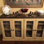 Bookcase with wire mesh doors.