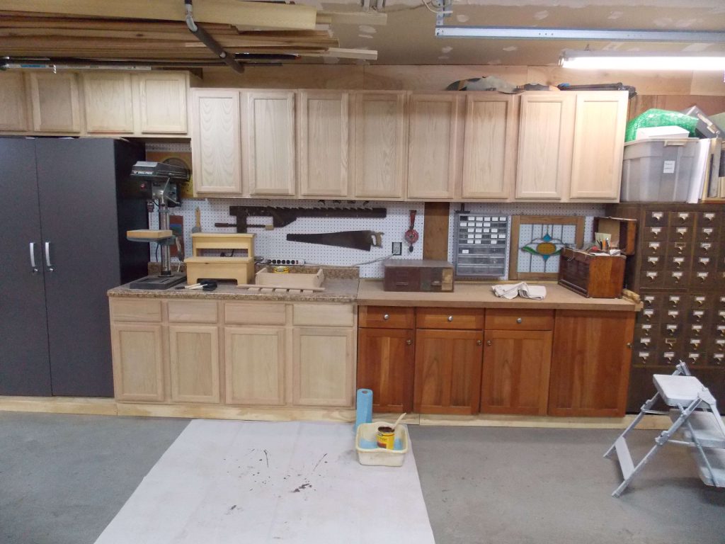 Unfinished cabinets prepped for staining.