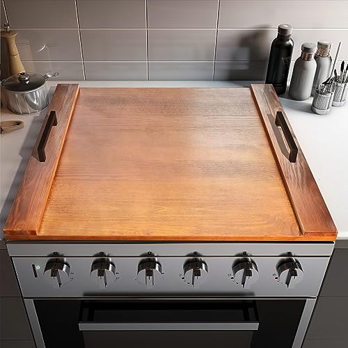 RV kitchen stove with a wood cutting board.